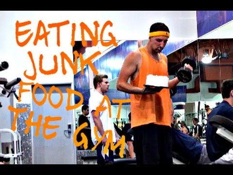 Dude Eats Junk Food While Working Out At Gym