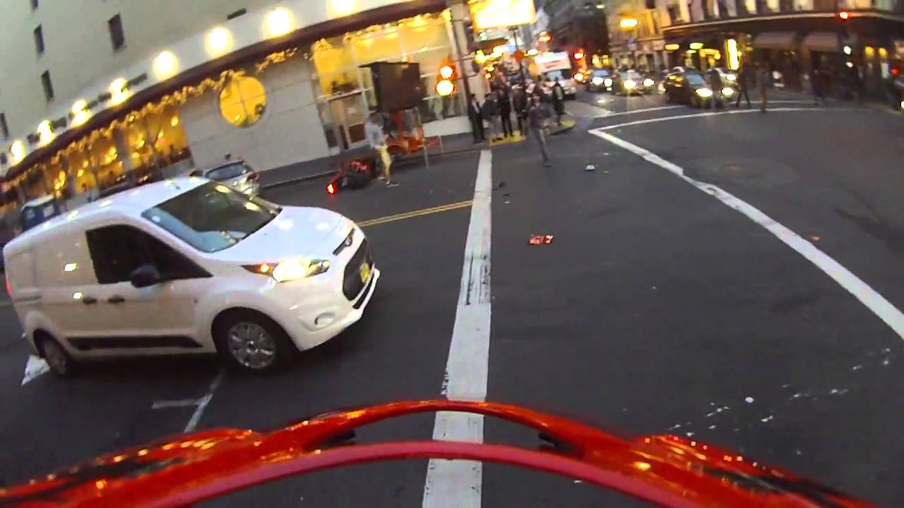 Motorcyclist Lands On His Feet After Being Smashed Into By A Red Light Runner